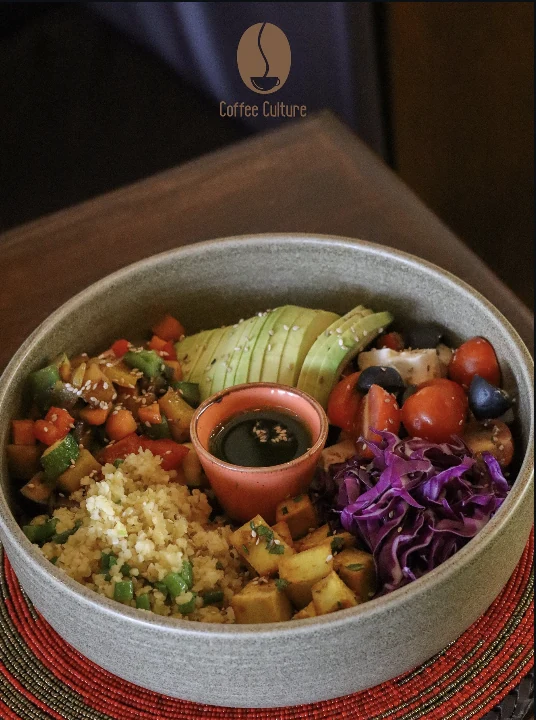 A colourful Buddha bowl with avocado, beetroot, mango and bulgur