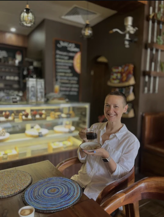 The Coffee Culture counter with its glass cake display and handwritten board