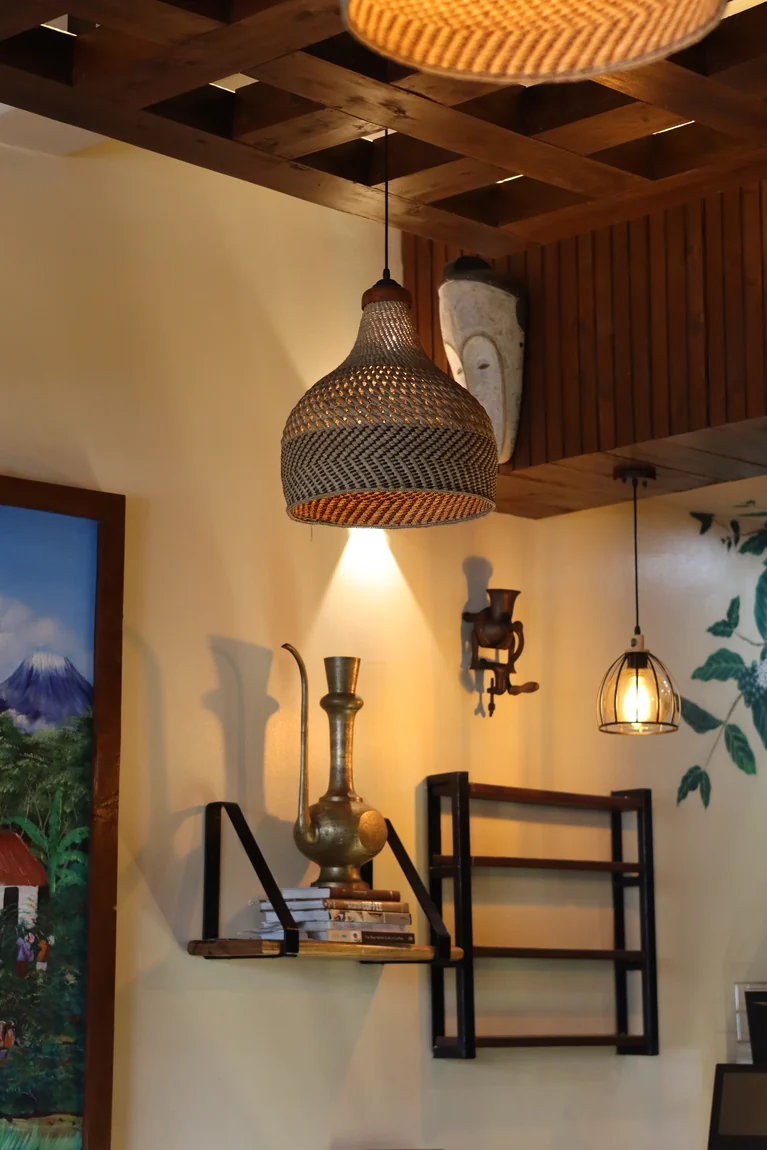 Woven pendant lamps and warm décor inside the café